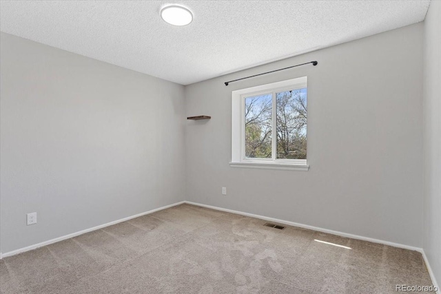 10895 W Bowles Pl, Littleton, CO 80127 - carpeted spare room with a textured ceiling and baseboards
