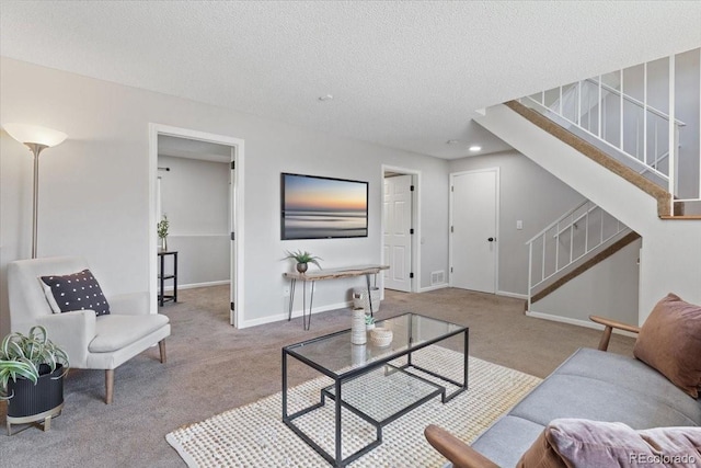 10895 W Bowles Pl, Littleton, CO 80127 - living area with carpet floors, stairs, a textured ceiling, baseboards, and recessed lighting