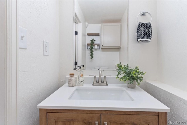 10895 W Bowles Pl, Littleton, CO 80127 - bathroom with vanity and a textured wall