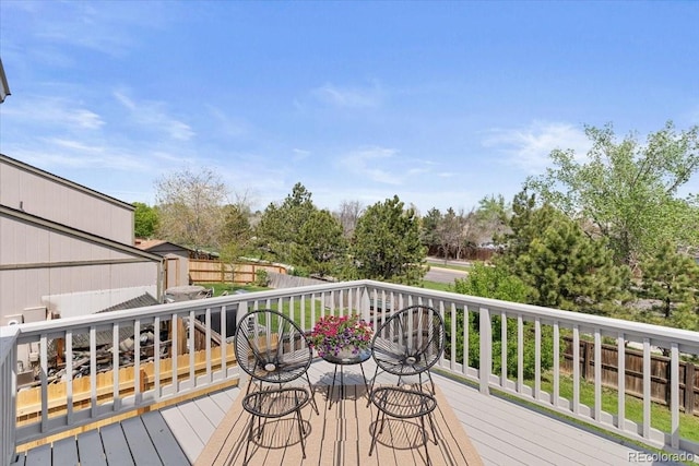 10895 W Bowles Pl, Littleton, CO 80127 - wooden deck with a shed, an outdoor structure, and fence