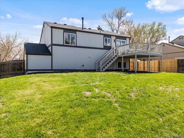 10895 W Bowles Pl, Littleton, CO 80127 - back of property with a wooden deck and stairway