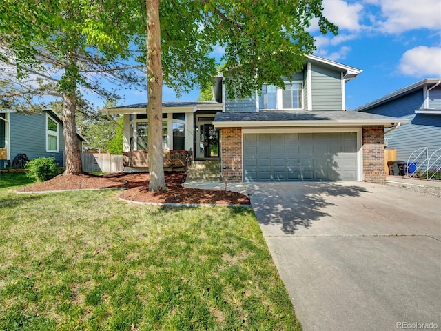 15915 E Mercer Cir, Aurora, CO 80013 - split level home featuring brick siding, an attached garage, driveway, and a front lawn