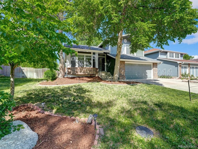 15915 E Mercer Cir, Aurora, CO 80013 - tri-level home featuring brick siding, a garage, and concrete driveway