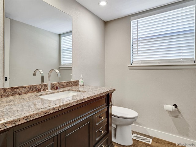 15915 E Mercer Cir, Aurora, CO 80013 - bathroom with wood finished floors, vanity, and recessed lighting