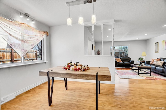 7819 Tejon St, Denver, CO 80221 - dining space featuring wood finished floors, a textured ceiling, and recessed lighting