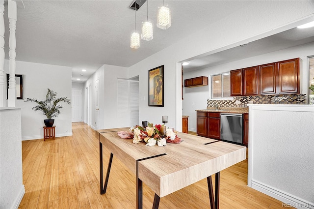 7819 Tejon St, Denver, CO 80221 - dining area featuring light wood-style floors, a textured ceiling, and recessed lighting