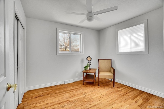 7819 Tejon St, Denver, CO 80221 - living area featuring healthy amount of natural light, light wood-style floors, and a ceiling fan
