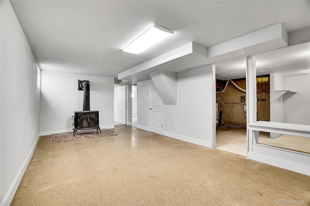 7819 Tejon St, Denver, CO 80221 - finished basement with a wood stove and a textured ceiling