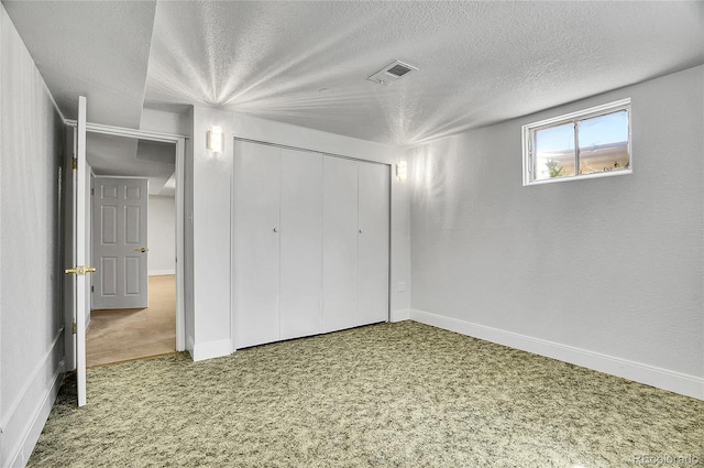 7819 Tejon St, Denver, CO 80221 - unfurnished bedroom featuring carpet flooring, a textured ceiling, and a closet