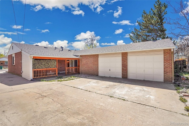 7819 Tejon St, Denver, CO 80221 - single story home featuring brick siding, concrete driveway, and a garage