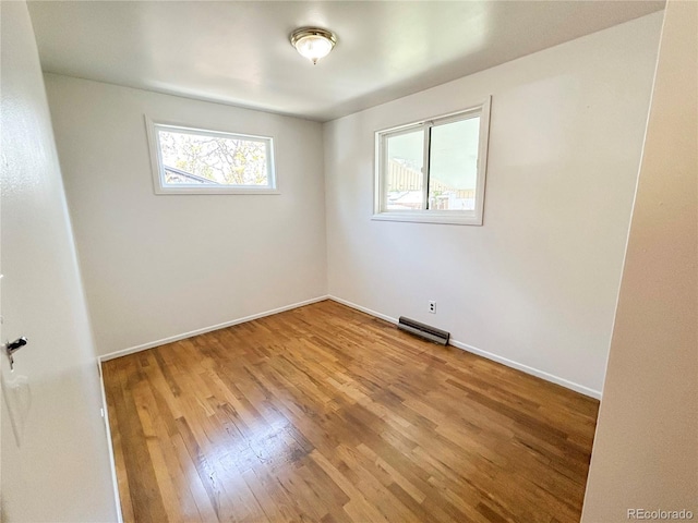 660 Wolff St, Denver, CO 80204 - unfurnished room with wood finished floors and baseboards
