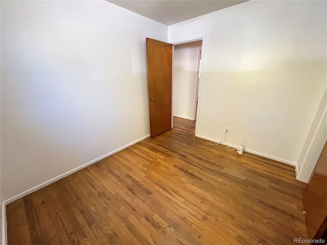 660 Wolff St, Denver, CO 80204 - spare room with hardwood / wood-style flooring and baseboards