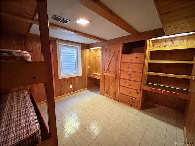 660 Wolff St, Denver, CO 80204 - unfurnished bedroom featuring wood walls and baseboards