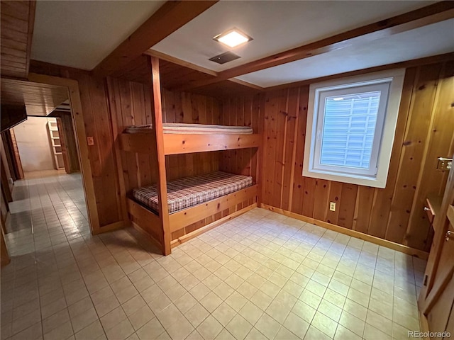 660 Wolff St, Denver, CO 80204 - unfurnished bedroom with wood walls, beam ceiling, a relaxing sauna, and baseboards