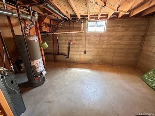 660 Wolff St, Denver, CO 80204 - below grade area featuring gas water heater and wood walls