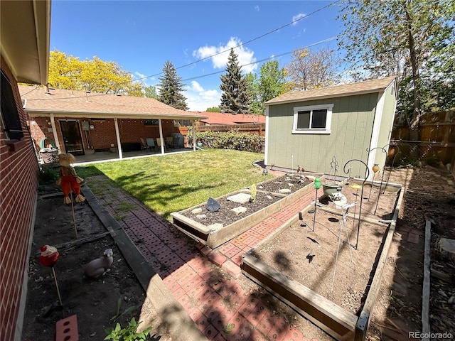 660 Wolff St, Denver, CO 80204 - view of yard featuring a garden and a patio area
