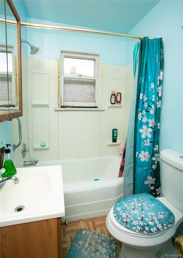 full bathroom featuring parquet floors, vanity, toilet, and shower / bath combo with shower curtain