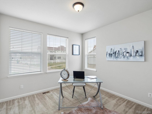 home office with baseboards, carpet floors, and visible vents
