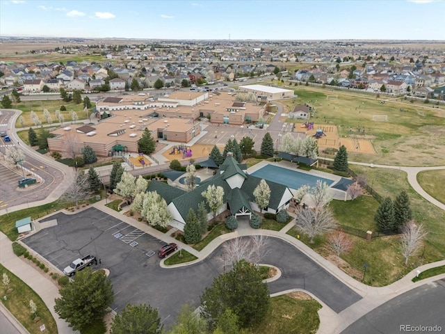 birds eye view of property with a residential view