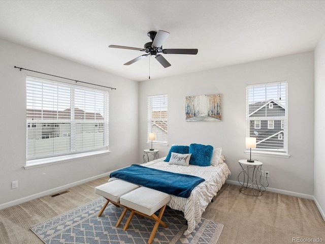 bedroom featuring a ceiling fan and baseboards