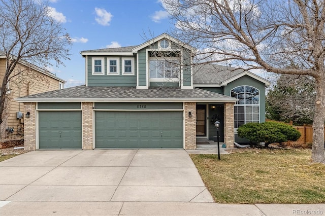 view of front facade with a shingled roof, a garage, concrete driveway, and brick siding