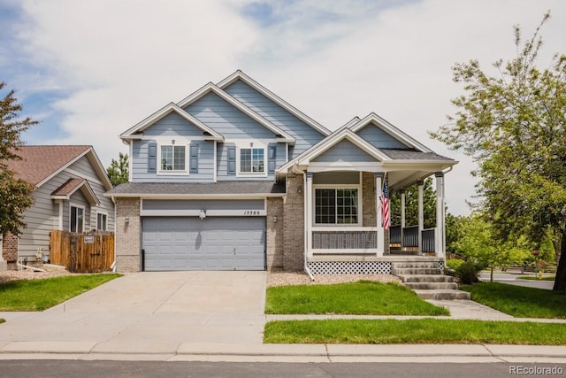 15389 E 99th Way, Commerce City, CO 80022 - view of front facade with a porch, an attached garage, concrete driveway, and brick siding