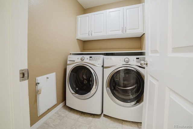 15389 E 99th Way, Commerce City, CO 80022 - laundry room with washing machine and clothes dryer, cabinet space, and baseboards