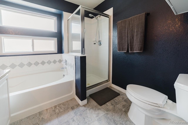 15389 E 99th Way, Commerce City, CO 80022 - bathroom featuring toilet, a bath, and a shower stall