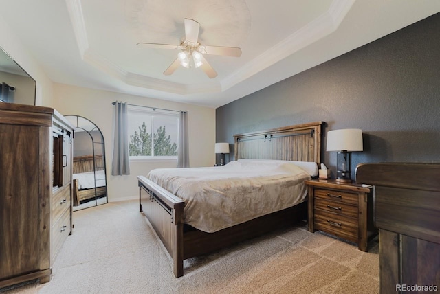 15389 E 99th Way, Commerce City, CO 80022 - bedroom featuring light colored carpet, a tray ceiling, ornamental molding, a ceiling fan, and baseboards