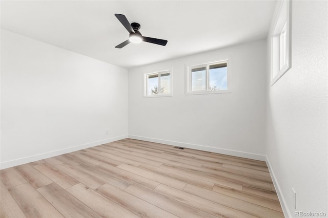 unfurnished room with ceiling fan and light hardwood / wood-style flooring