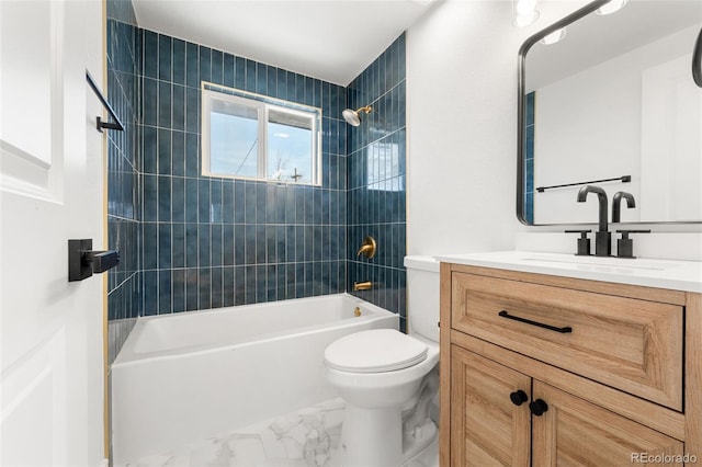 full bathroom with vanity, tiled shower / bath combo, and toilet