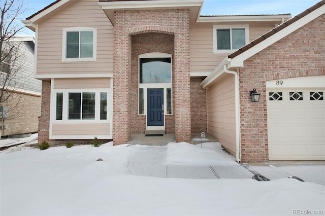 front of property with a garage