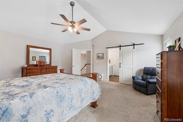 carpeted bedroom featuring ceiling fan, lofted ceiling, and a barn door