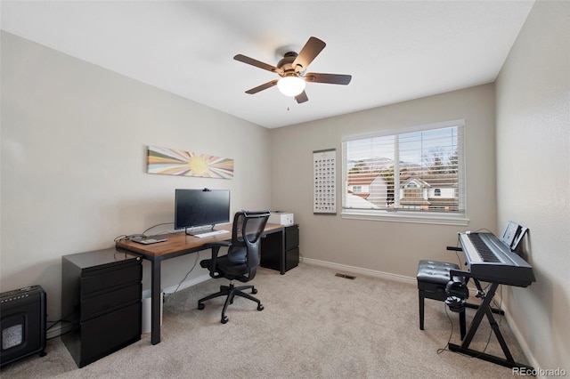 carpeted office with ceiling fan