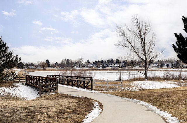 view of community with fence