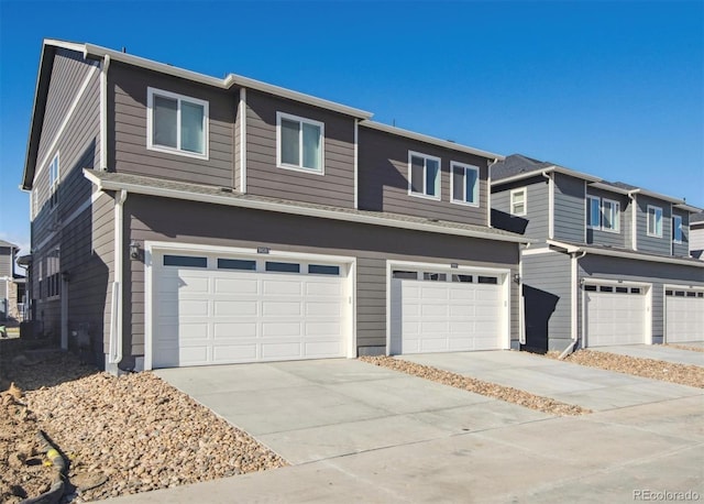 18726 E 99th Ave, Commerce City, CO 80022 - view of front of property featuring an attached garage and concrete driveway