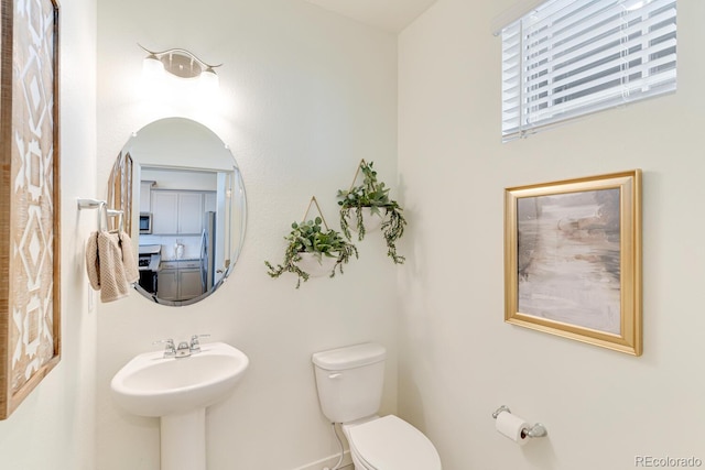 18726 E 99th Ave, Commerce City, CO 80022 - bathroom featuring toilet and baseboards