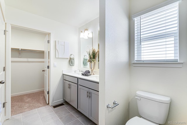 18726 E 99th Ave, Commerce City, CO 80022 - bathroom with double vanity and a walk in closet
