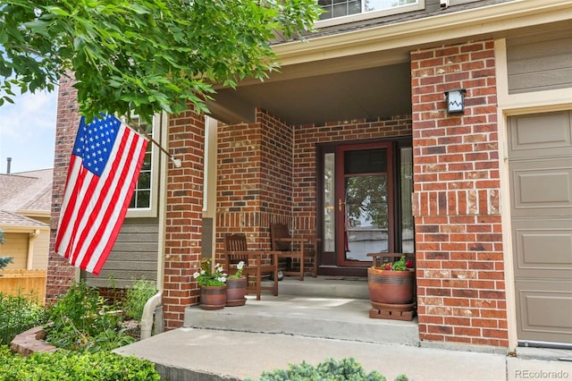 15962 W 70th Dr, Arvada, CO 80007 - property entrance with brick siding and covered porch