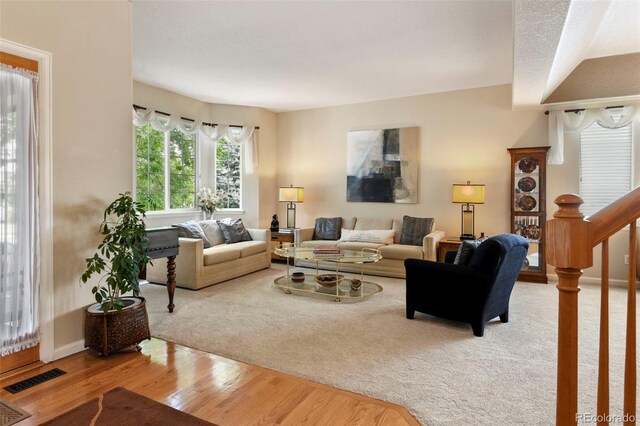 15962 W 70th Dr, Arvada, CO 80007 - living room featuring wood finished floors and baseboards