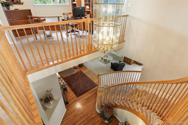 15962 W 70th Dr, Arvada, CO 80007 - staircase featuring wood finished floors and a towering ceiling