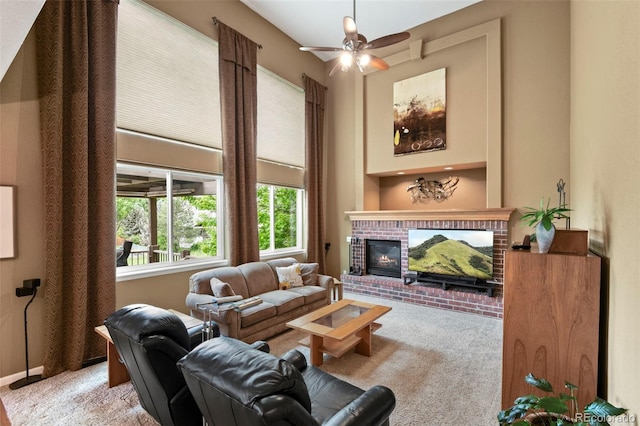 15962 W 70th Dr, Arvada, CO 80007 - carpeted living area featuring a fireplace and a ceiling fan
