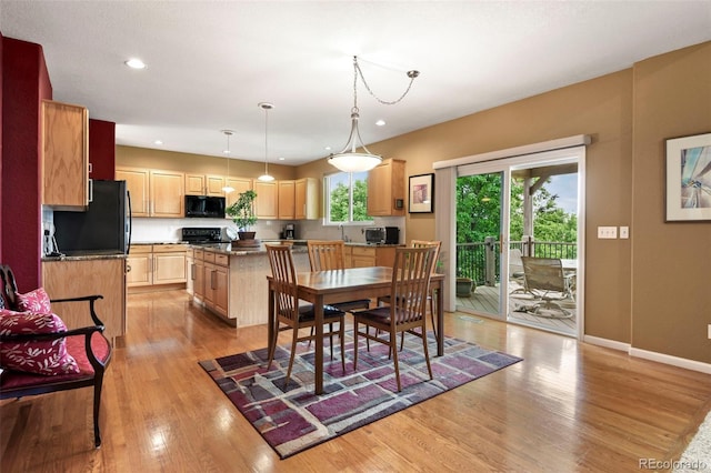 15962 W 70th Dr, Arvada, CO 80007 - dining area with light wood finished floors and recessed lighting