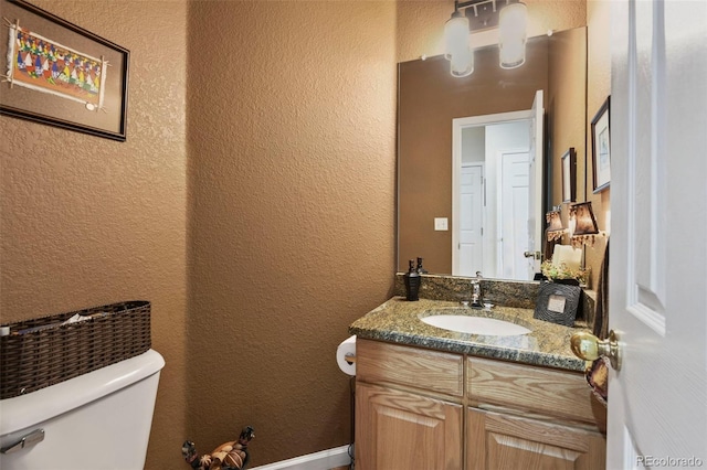 15962 W 70th Dr, Arvada, CO 80007 - half bath featuring a textured wall and vanity