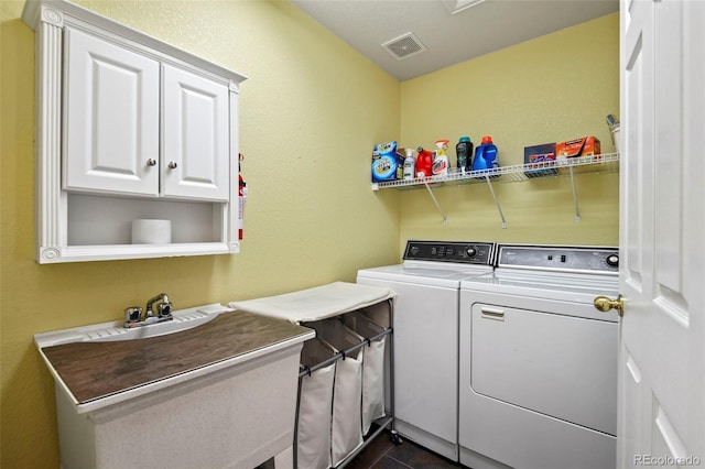 15962 W 70th Dr, Arvada, CO 80007 - laundry area featuring washing machine and dryer and cabinet space