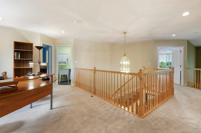 15962 W 70th Dr, Arvada, CO 80007 - hallway featuring carpet floors, an upstairs landing, and recessed lighting