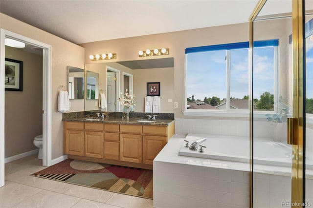 15962 W 70th Dr, Arvada, CO 80007 - full bath with double vanity, a garden tub, and tile patterned floors