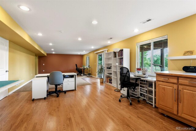 15962 W 70th Dr, Arvada, CO 80007 - home office featuring light wood finished floors and recessed lighting