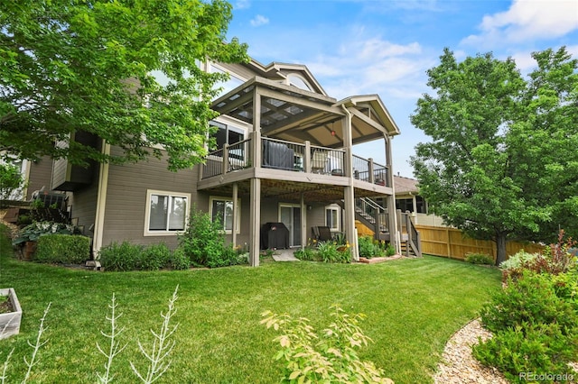 15962 W 70th Dr, Arvada, CO 80007 - back of property with stairs, a deck, and a sunroom