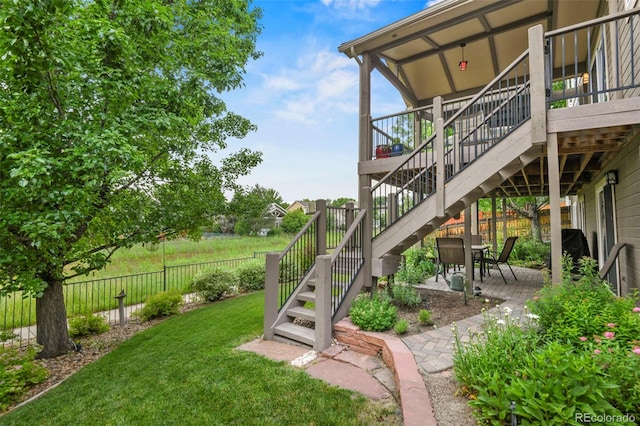 15962 W 70th Dr, Arvada, CO 80007 - view of yard featuring stairway, a patio area, and a deck
